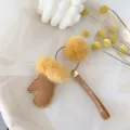 Adorable ginger yellow mink fur glove-shaped keychain charm with pompom and leather strap - Turmeric