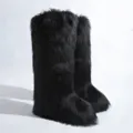 Detail view of black knee-high faux fur boots featuring plush texture and warm design. - 36 / Black