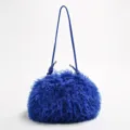 Vibrant electric blue faux fur cloud bag featuring adjustable shoulder strap design - Sapphire Blue