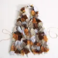 Sexy multi-colored faux fur halter top with open back and silver cross pendant details. - One Size / Brown Color Block