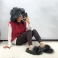 Model wearing punk style faux raccoon fur slippers and matching fluffy hat set - Dark Gray - (Faux Wool Sole 2.0 and Hat Set) / 36 (US 3)
