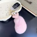 Close-up of fluffy pink rex rabbit fur chicken drumstick keychain charm - 12cm / Water Pink