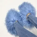 Close-up of fluffy light blue Mongolian sheep fur slides worn with blue denim jeans - 5 (Shoe Length 250, Inner Length 225) / Sky Blue