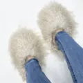 Detail view of fluffy white Mongolian sheepskin fur slides worn with blue denim jeans - 5 (Shoe Length 250, Inner Length 225) / Off White