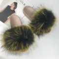 Stylish golden PVC slides featuring fluffy black and yellow faux raccoon fur detail. - Blue Base with Yellow Tips