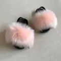 Macro view of pink faux fur kids sandals with comfortable black elastic back straps. - 4C / Pink
