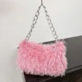 Trendy pink faux fur shoulder bag featuring a chunky silver chain strap for women's fashion. - Pink