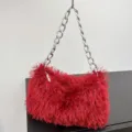 Stylish red plush underarm bag featuring a chunky silver chain strap for evening events - Red