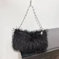 Stylish black faux fur underarm baguette handbag featuring a chunky silver metal chain strap - Black
