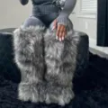 Detailed close-up of fluffy grey faux fur knee-high snow boots in a trendy Y2K winter style - Smoky Gray Raccoon Fur