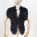 Macro detail of black Mongolian faux fur halter vest with curly long hair texture - One Size / Black