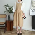 Elegante delantal de algodón beige plisado con bolsillos para cocina o cafetería - Caqui