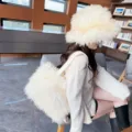Asian model wearing white faux Mongolian sheep fur bucket hat and matching tote bag - Off White