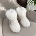 Fluffy white and grey faux raccoon fur snow boots in trendy Y2K style for women - 38 / White with Black Tips