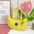 Cute yellow banana-shaped canvas handbag featuring cartoon smiley face embroidery - Yellow