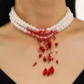 Macro detail view of elegant multi-layer white pearl necklace with red beaded tassels - Three Layer Tassel Style (01 White Red)