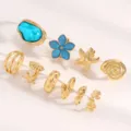 Close-up detail of 10-piece gold and blue baroque style sea-themed fashion ring set - Ocean Series Set (0520)