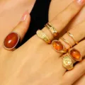 7-piece vintage gold-tone ring set featuring amber-style stones and textured lava designs - Amber Gemstone Set (WG0-856)