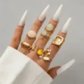 Vintage gold-tone ring set featuring unique lava texture and elegant inset stones on hand - Vintage Lava Set (H-109)