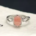 Detailed macro shot of natural oval rhodochrosite ring with vintage silver setting - Open Adjustable / Rhodonite
