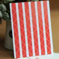 Decorative photo corner stickers with red star pattern and lace edge for DIY albums and scrapbooks. - 78 Pieces per Sheet / Red Star