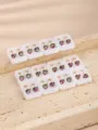 Detail shot of stainless steel rhinestone heart ear clip converters in white display boxes. - Heart Shape Multicolor Rhinestone Style / 12 Pairs Set