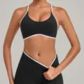Black sports bra and leggings set with white trim, adjustable straps, fitness wear variant. - S / Tops / Black