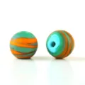 Detail view of frosted mixed silk glass beads, displaying vibrant swirl textures and matte finish. - 12mm Pearl / A Green & Orange Mixed Beads