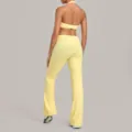 Elegantes gelbes Halfter Yoga Crop Top und passende Schlaghose Fitness Sport Set. - Durian Gelb