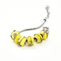 Bracelet serpent en argent avec perles en verre jaune, détails feuille d'or et motifs floraux. - Porcelaine jaune style D