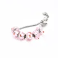 Silver snake chain charm bracelet with pink glass floral beads and orange dots jewelry. - A Pink