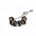 Silbernes Schlangenkettenarmband mit schwarzen Glasperlen, weißen Streifen und bunten Punkten. - 9*14mm / D-Schwarz