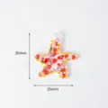 Glass starfish pendant charm with red and yellow spots, measuring 30x35mm and weighing 4g. - Starfish 08 (Transparent)