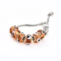 Bracelet chaîne serpent breloques verre œil mauvais ambre bijoux cristal faits main - Jacquard Café (T&C)