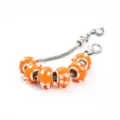 Bracelet perles verre de Murano orange chaîne serpent argent et motif floral élégant. - Orange style A