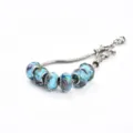 Bracelet en chaîne serpent avec perles en verre bleu et finitions argentées étincelantes. - Porcelaine bleu lac style B