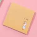 Detailed close-up of a cute yellow sticky note pad with funny duck cartoon design for daily notes. - Confident Duck