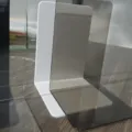 Minimalist L-shaped acrylic bookends set, sturdy desktop book stops for organizing shelves. - New Transparent Black Grey L