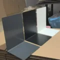 Metal bookend for desk organization, L-shaped book support stand in grey, black, and white colors. - Iron L-Shape Bookends / Off White