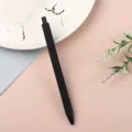 Sleek black retractable gel pen for smooth writing, perfect for office and school supplies. - Black