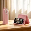 Pink foldable silicone phone stand with carabiner, flexible desktop mount for mobile devices. - Neutral English Packaging / Pink