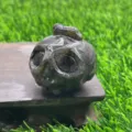 Natural gemstone carved pumpkin ghost head crystal detail view, perfect for Halloween collection. - Larvikite