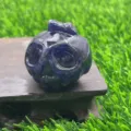 Detail shot of the 3.5cm natural gemstone carved pumpkin ghost skull crystal ornament close-up - Blue Sodalite