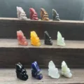 Detailed view of assorted 3cm natural gemstone crystal fairy carvings in various crystal types. - Assorted Colors