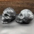 Natural stone carved skull ornament, 7cm black flash grid crystal skull healing decor. - Black Line Stone