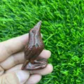 Close-up of a 5cm natural gemstone carved raven bird crystal figurine, exquisite detail. - Red Sesame