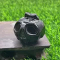 Black obsidian crystal carved ghost pumpkin skull figurine, perfect for Halloween decor. - Obsidian