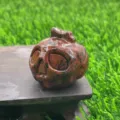 3.5cm Natural Stone Pumpkin Skull Carving Red Crystal Ghost Figurine for Halloween Decor - Mahogany Obsidian