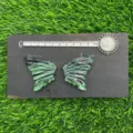 Natural gemstone butterfly wings carving crystal stone jewelry craft detail view - Ruby Zoisite