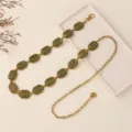 Detailed view of the vintage metal waist chain with delicate hollow carved links for women. - Antique Gold
